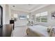 Serene bedroom boasts large windows, water view, and neutral decor, offering a relaxing retreat at 12908 Crystal Clear Pl, Bradenton, FL 34211