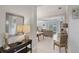 Inviting foyer with decorative mirror, console table, and views into the adjacent living spaces at 12908 Crystal Clear Pl, Bradenton, FL 34211