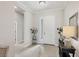 Bright foyer featuring a white front door, tile floors, and decorative accents at 12908 Crystal Clear Pl, Bradenton, FL 34211