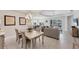 Open floor plan showcases the dining and living area, enhanced by natural light and neutral tones at 12908 Crystal Clear Pl, Bradenton, FL 34211