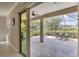 Spacious screened-in patio featuring neutral tile flooring and comfortable outdoor seating for relaxing at 12908 Crystal Clear Pl, Bradenton, FL 34211