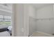 Compact walk-in closet adjacent to the primary bedroom, providing practical storage space at 12908 Crystal Clear Pl, Bradenton, FL 34211