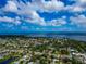 Vast aerial view captures the beautiful ocean and a community near the water and lush landscapes at 1312 73Rd Nw St, Bradenton, FL 34209