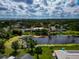 Aerial view of property near a lake, showcasing the home's location and neighborhood in its surroundings at 1312 73Rd Nw St, Bradenton, FL 34209