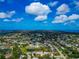 Wide aerial shot showcases a home with lake access in a serene community setting with water views at 1312 73Rd Nw St, Bradenton, FL 34209