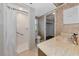 Small bathroom with shower, toilet and pedestal sink with wallpaper at 1312 73Rd Nw St, Bradenton, FL 34209