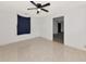 This bedroom features tile flooring and a ceiling fan, creating a comfortable space at 1312 73Rd Nw St, Bradenton, FL 34209