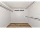 Empty closet space with rods and wooden floor at 1312 73Rd Nw St, Bradenton, FL 34209