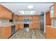 Well-lit kitchen with stainless steel appliances, light wood cabinetry, and decorative backsplash at 1312 73Rd Nw St, Bradenton, FL 34209