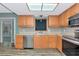 Charming kitchen with stainless steel appliances, warm wood cabinets, and recessed lighting at 1312 73Rd Nw St, Bradenton, FL 34209