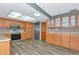 Charming kitchen with stainless steel appliances, warm wood cabinets, and unique overhead lighting at 1312 73Rd Nw St, Bradenton, FL 34209