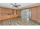 Inviting living room with wood-look floors, built-in shelving, and abundant natural light at 1312 73Rd Nw St, Bradenton, FL 34209