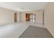 Spacious living room with tile flooring and neutral walls leads to multiple rooms at 1312 73Rd Nw St, Bradenton, FL 34209