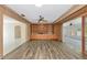 Cozy living room with wood-look floors, built-in shelving, and views to other rooms at 1312 73Rd Nw St, Bradenton, FL 34209