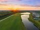 Breathtaking aerial view of a scenic golf course community at sunset at 17118 Vardon Ter # 404, Bradenton, FL 34211