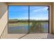 Screened in balcony with views of golf course, lake and trees at 17118 Vardon Ter # 404, Bradenton, FL 34211
