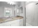 Contemporary bathroom with granite counters, glass shower, and neutral decor at 17118 Vardon Ter # 404, Bradenton, FL 34211