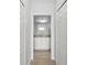 Bright bathroom featuring white cabinets, granite countertops, and neutral-toned tile flooring at 17118 Vardon Ter # 404, Bradenton, FL 34211