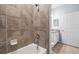 Bathroom featuring tiled walls in shower and granite countertops at 17118 Vardon Ter # 404, Bradenton, FL 34211