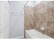 Bright bathroom features a shower-tub combination with decorative tile surround at 17118 Vardon Ter # 404, Bradenton, FL 34211