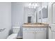 Bright bathroom features a granite countertop and a vanity with a sink at 17118 Vardon Ter # 404, Bradenton, FL 34211