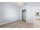 Empty bedroom with wood flooring and an open closet at 17118 Vardon Ter # 404, Bradenton, FL 34211