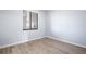 Bright bedroom featuring neutral walls, window, and laminate wood-look flooring at 17118 Vardon Ter # 404, Bradenton, FL 34211