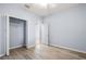 Bedroom featuring neutral walls, wood-look flooring, and closet at 17118 Vardon Ter # 404, Bradenton, FL 34211