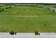 Aerial view of a driving range with lush greenery and golf carts at 17118 Vardon Ter # 404, Bradenton, FL 34211