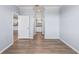 Neutral hallway leading to bathroom with kitchen visible through open door at 17118 Vardon Ter # 404, Bradenton, FL 34211