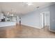 Spacious living room featuring tile flooring and light, neutral wall colors at 17118 Vardon Ter # 404, Bradenton, FL 34211