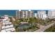Beautiful shot of the beachfront property which includes tennis courts and mature landscaping at 1800 Benjamin Franklin Dr # B1009, Sarasota, FL 34236