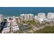 A lovely aerial view of the building complex, which sits on the beach on a clear sunny day at 1800 Benjamin Franklin Dr # B1009, Sarasota, FL 34236