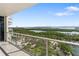 This spacious balcony features glass railings and boasts stunning water views at 1800 Benjamin Franklin Dr # B1009, Sarasota, FL 34236