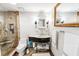 Modern bathroom with neutral colors, new shower, vanity storage, and lots of light at 1800 Benjamin Franklin Dr # B1009, Sarasota, FL 34236