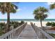 Convenient beach access through a scenic boardwalk, leading to pristine sands and the beautiful ocean at 1800 Benjamin Franklin Dr # B1009, Sarasota, FL 34236
