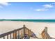 Direct beach access from stairs, offering stunning views of the ocean and shoreline for residents at 1800 Benjamin Franklin Dr # B1009, Sarasota, FL 34236