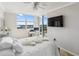 Bright bedroom with a comfortable bed, large window with views, and a sleek modern design at 1800 Benjamin Franklin Dr # B1009, Sarasota, FL 34236