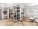 Open floor plan featuring a dining area with marble floors, a glass table and decorative shelving at 1800 Benjamin Franklin Dr # B1009, Sarasota, FL 34236