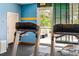 Modern gym features treadmills with natural light streaming through the large window at 1800 Benjamin Franklin Dr # B1009, Sarasota, FL 34236