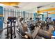 Fitness center features elliptical machines, treadmills, and large mirror offering a full-body view at 1800 Benjamin Franklin Dr # B1009, Sarasota, FL 34236