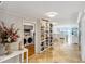 Hallway featuring marble floors, decorative shelving and views to ocean at 1800 Benjamin Franklin Dr # B1009, Sarasota, FL 34236