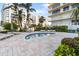 Relaxing community hot tub with comfortable lounge seating, lush landscaping and other resort amenities at 1800 Benjamin Franklin Dr # B1009, Sarasota, FL 34236