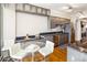 Bright modern kitchen features stainless steel appliances, granite countertops, sleek gray cabinetry, and breakfast nook at 1800 Benjamin Franklin Dr # B1009, Sarasota, FL 34236