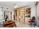 Bright living room has built-in shelving and a cozy seating area, ideal for relaxation and showcases marble flooring at 1800 Benjamin Franklin Dr # B1009, Sarasota, FL 34236