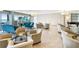 Elegant lobby with comfortable seating, beautiful chandeliers, and stunning ocean views at 1800 Benjamin Franklin Dr # B1009, Sarasota, FL 34236