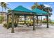 Charming poolside cabana with seating areas offering shade and relaxation, with ocean views at 1800 Benjamin Franklin Dr # B1009, Sarasota, FL 34236