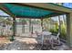 View of an enclosed tennis court shelter area with seating at the residential community at 1800 Benjamin Franklin Dr # B1009, Sarasota, FL 34236