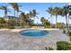 Relaxing jacuzzi surrounded by lush greenery and views of the ocean, providing a serene escape at 1800 Benjamin Franklin Dr # B1009, Sarasota, FL 34236