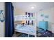 Cozy bunk room with colorful bedding, blue accents, and fun under the sea decorations at 2201 Avenue C, Bradenton Beach, FL 34217